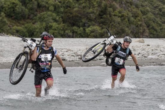 Mens team racing during a mountain bike stage of Red Bull Defiance 2016